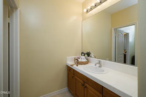 a large bathroom with a sink a large mirror and a shower