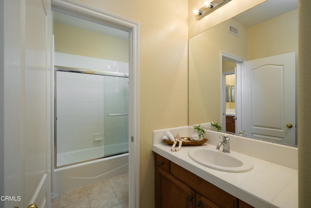 3921 Chapman Court Altadena, CA 91001 - Photo 36 of 64 a bathroom with a granite countertop sink toilet and shower