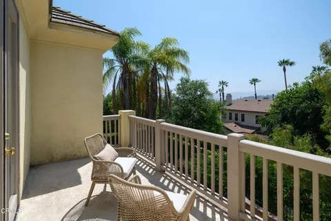 a view of house with outdoor space and sitting area