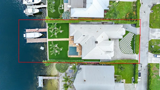 an aerial view of a house with pool