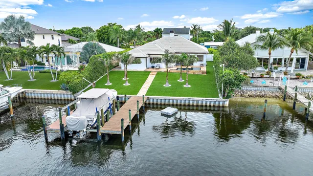aerial view of a house with a patio and a garden