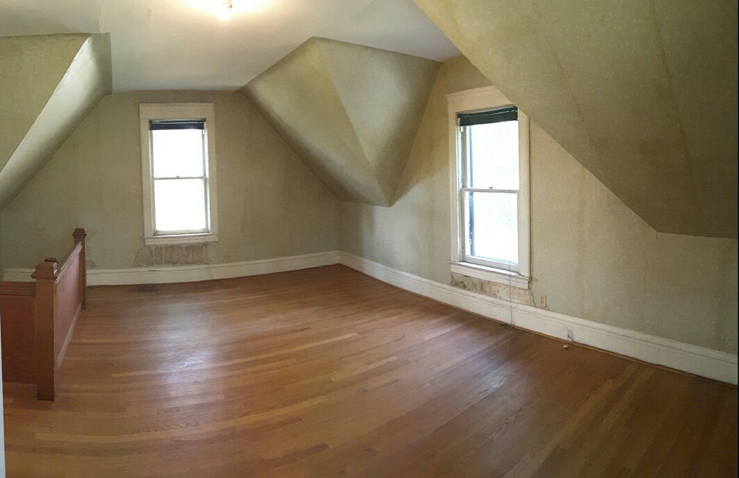 3730 Prairie Road Rockford, IL 61102 - Photo 6 of 12 an empty room with wooden floor and windows