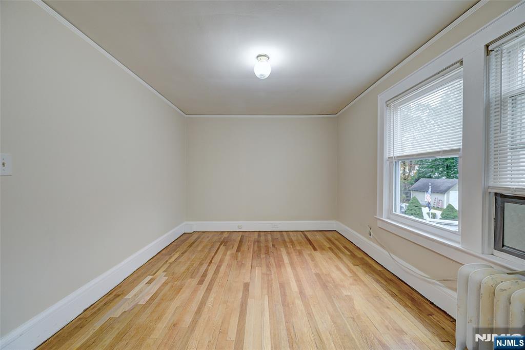 24 Brook Street Springfield, NJ 07081 - Photo 17 of 28 a view of a room with wooden floor and windows