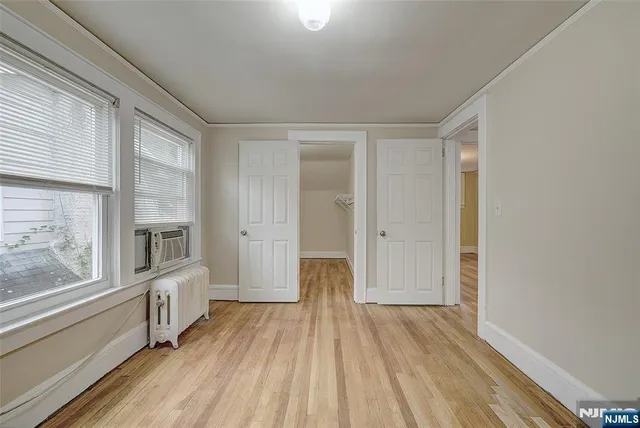 a view of a livingroom with wooden floor
