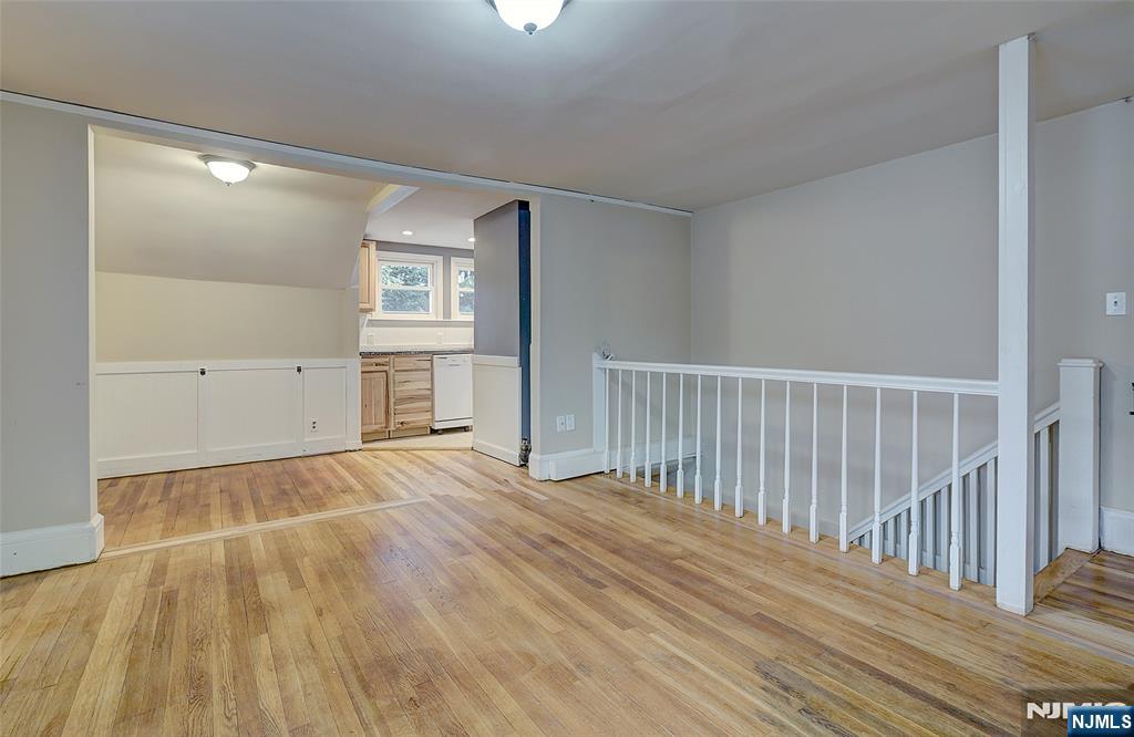24 Brook Street Springfield, NJ 07081 - Photo 21 of 28 a view of an empty room with wooden floor and a window