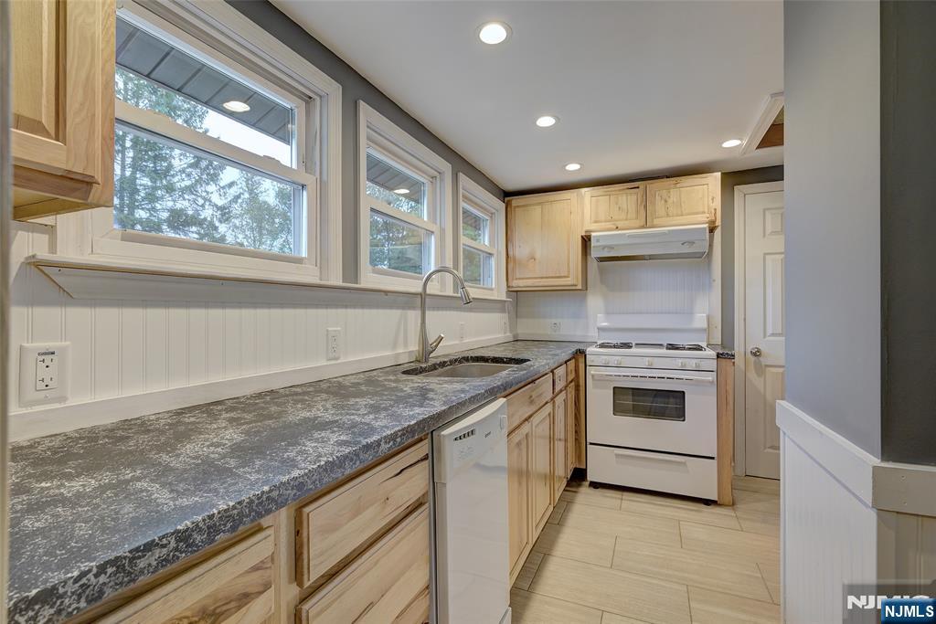 24 Brook Street Springfield, NJ 07081 - Photo 22 of 28 a kitchen with a stove and a sink