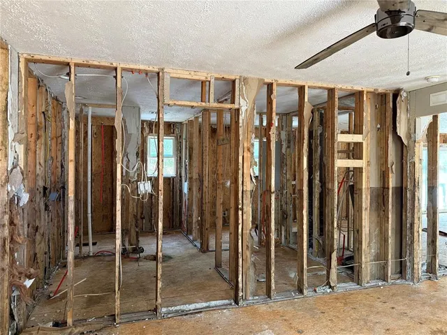 a bathroom with a shower and a sink