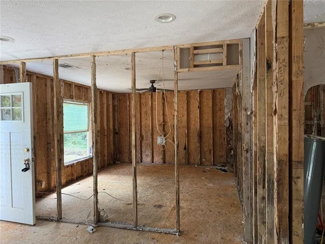 a view of a bathroom with a tub and shower