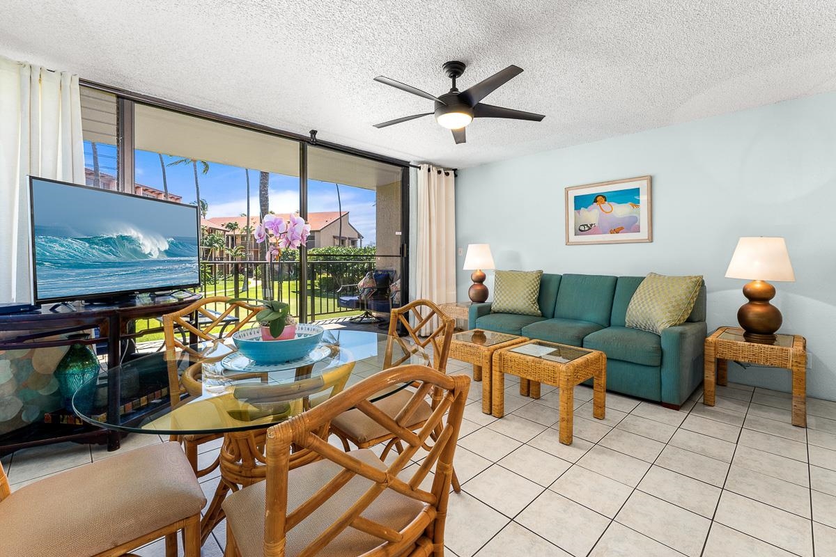 940 South Kihei Road, Unit B204 Kihei, HI 96753 - Photo 2 of 30 a living room with furniture and a flat screen tv