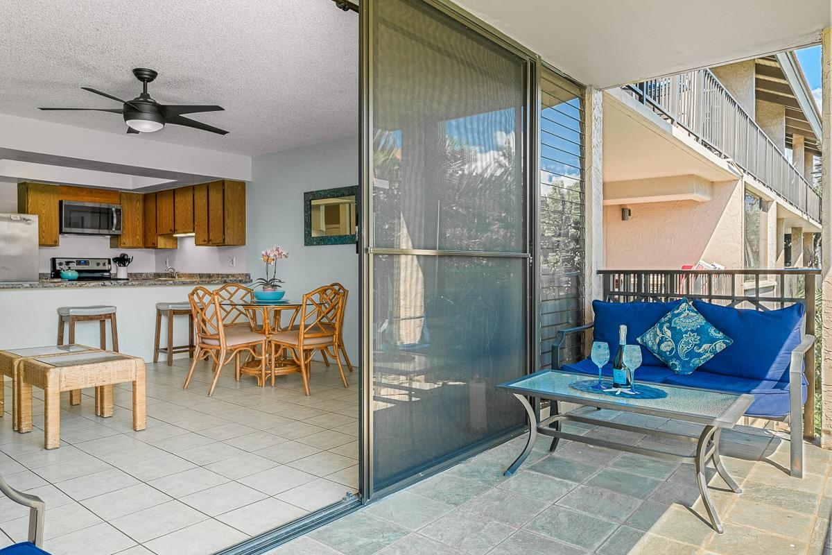 940 South Kihei Road, Unit B204 Kihei, HI 96753 - Photo 23 of 30 a dining room with furniture and a chandelier