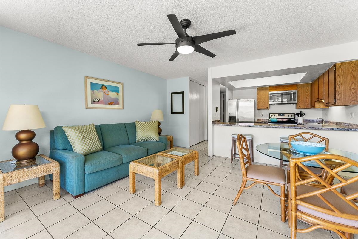 940 South Kihei Road, Unit B204 Kihei, HI 96753 - Photo 5 of 30 a living room with furniture and a view of kitchen