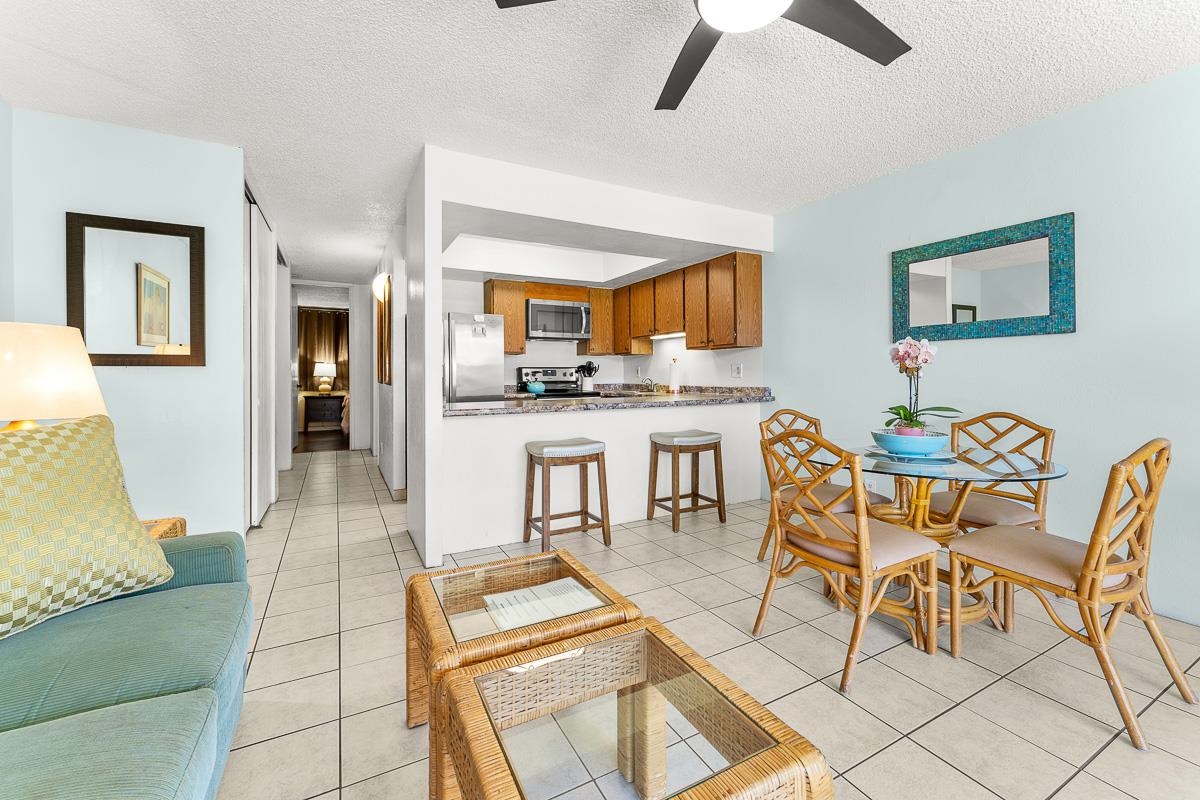940 South Kihei Road, Unit B204 Kihei, HI 96753 - Photo 6 of 30 a view of a dining room with furniture and a rug