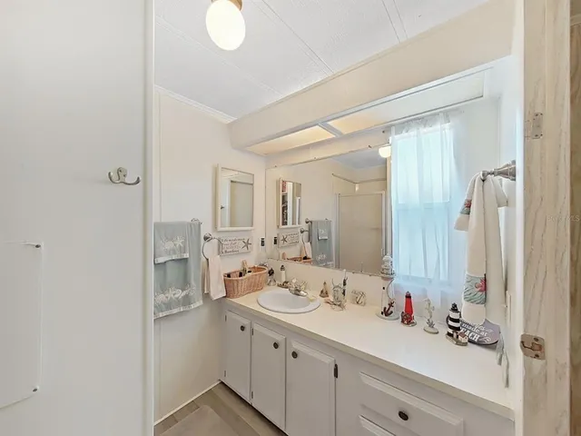 a bathroom with a double vanity sink mirror and double