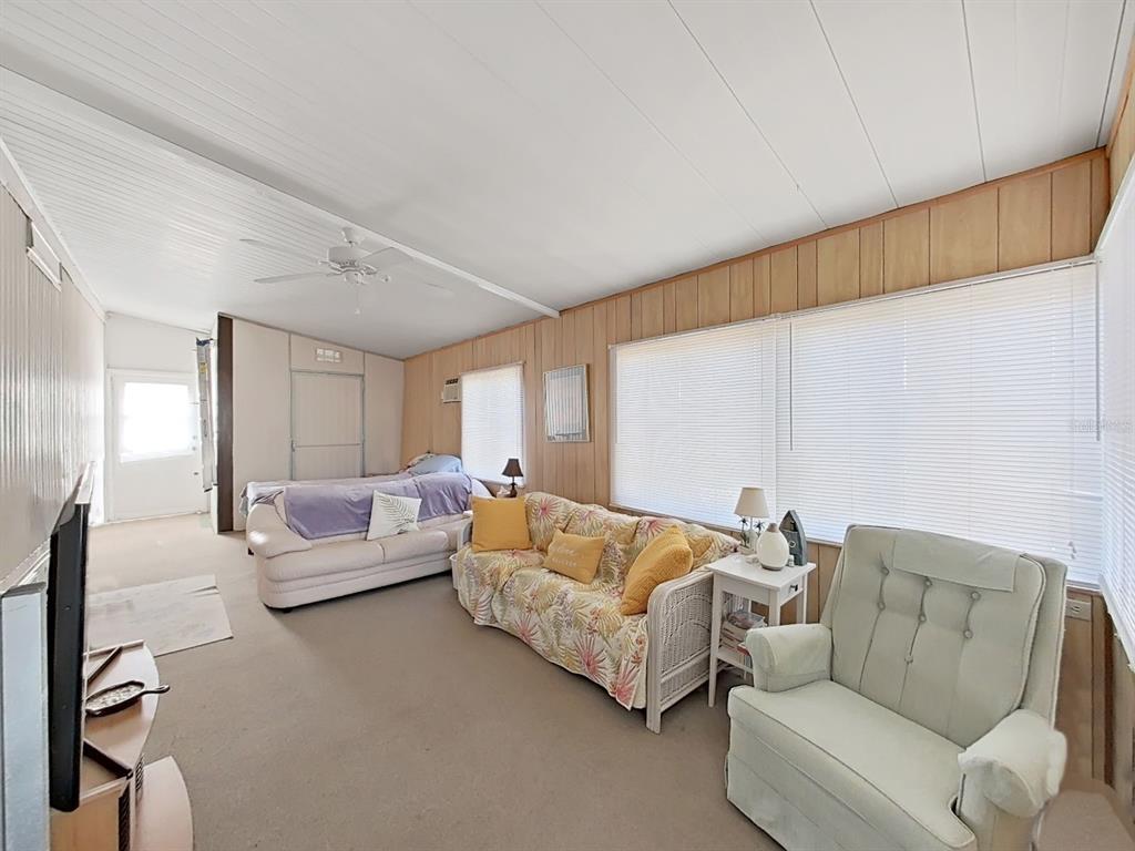12501 Ulmerton Road, Unit 140 Largo, FL 33774 - Photo 2 of 20 a living room with furniture and a couch