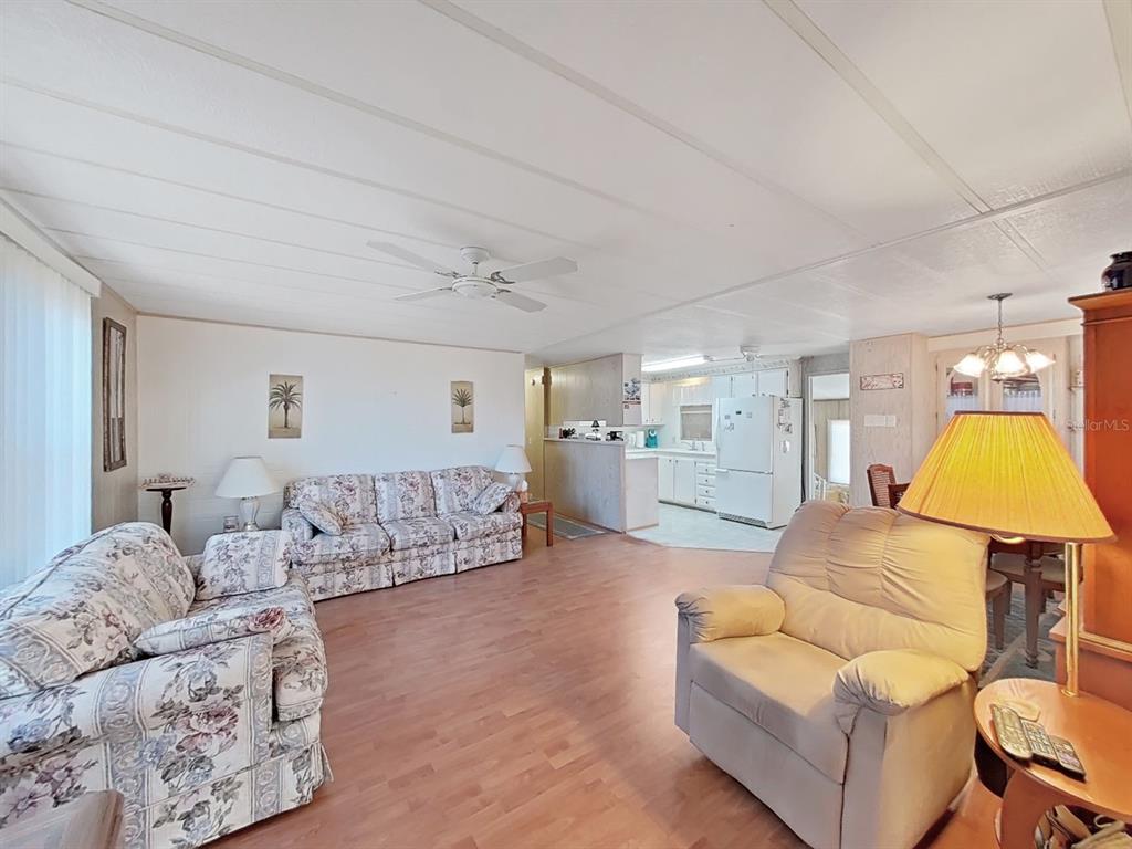 12501 Ulmerton Road, Unit 140 Largo, FL 33774 - Photo 6 of 20 a living room with furniture and a couch