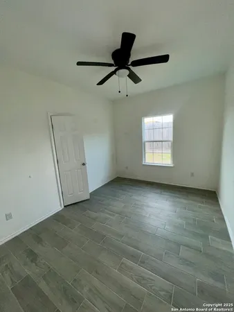 an empty room with a empty space and windows