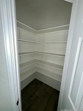 a empty closet with white paint
