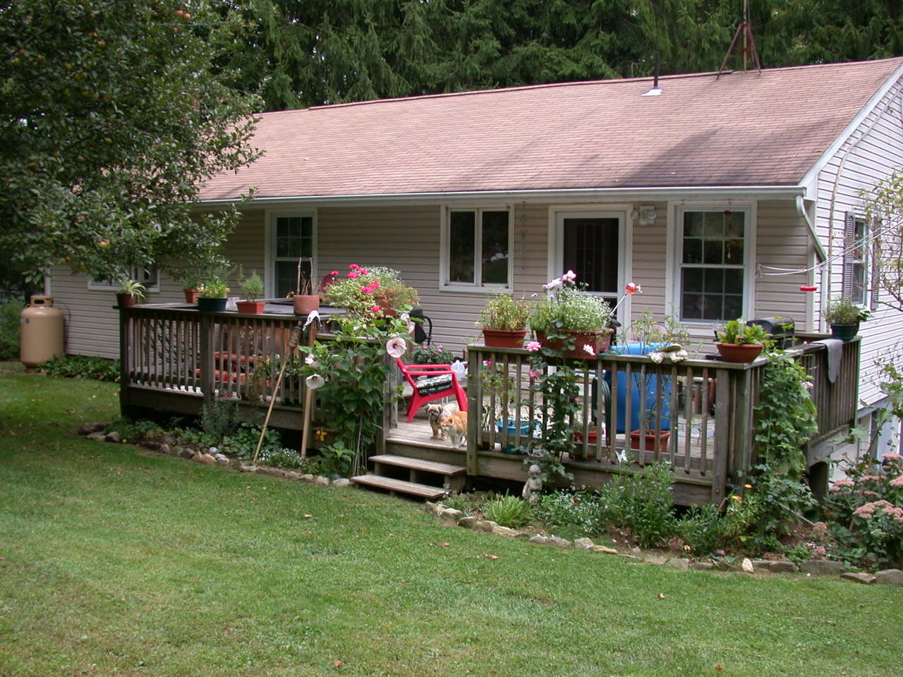 105 Gibbs Road Otis, MA 01253 - Photo 3 of 16 a view of a house with sitting area and garden