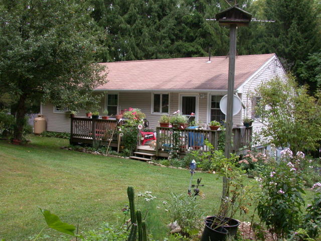 105 Gibbs Road Otis, MA 01253 - Photo 4 of 16 a backyard of a house with yard and outdoor seating
