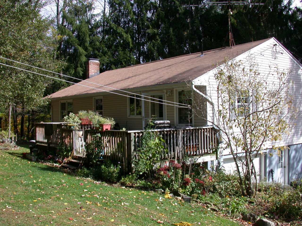 105 Gibbs Road Otis, MA 01253 - Photo 7 of 16 a view of a house with a yard and garden