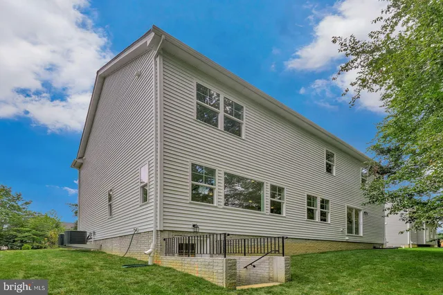 a view of house and outdoor space with yard