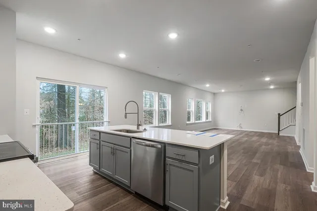 a kitchen with cabinets and stainless steel appliances