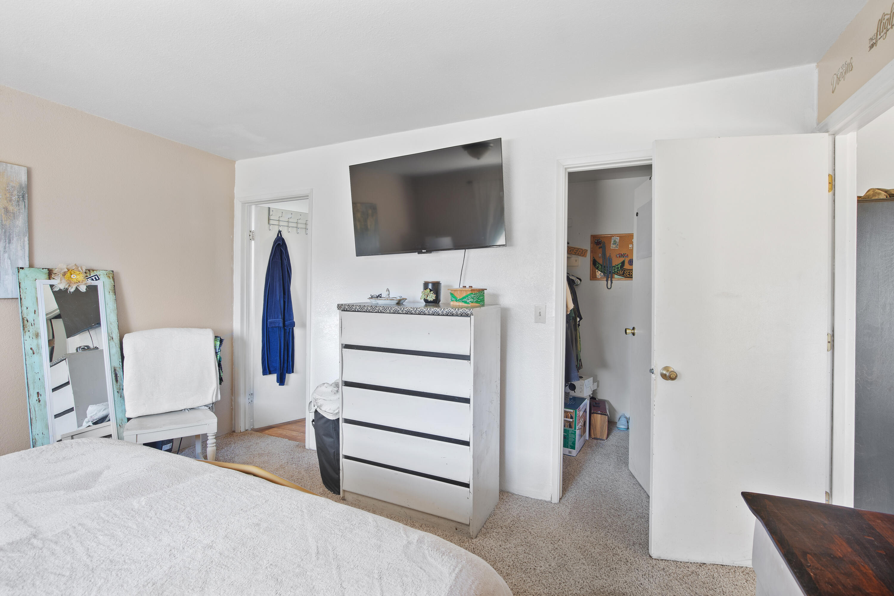 12748 Water Gap Road Williams, OR 97544 - Photo 13 of 35 a bedroom with a bed and a flat screen tv