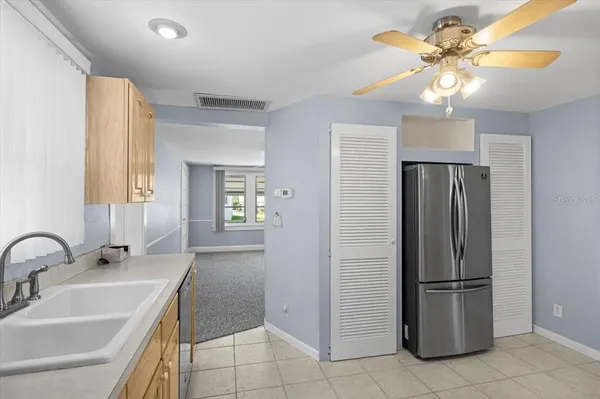 a bathroom with a sink a light fixture and a mirror