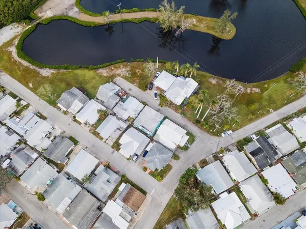 an aerial view of a house with a swimming pool