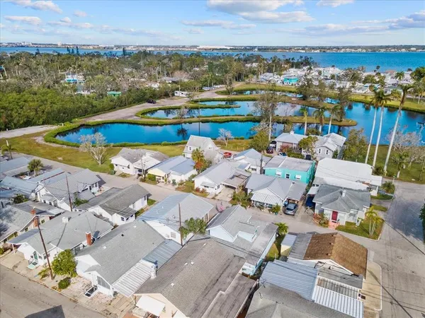 an aerial view of a house with a ocean view