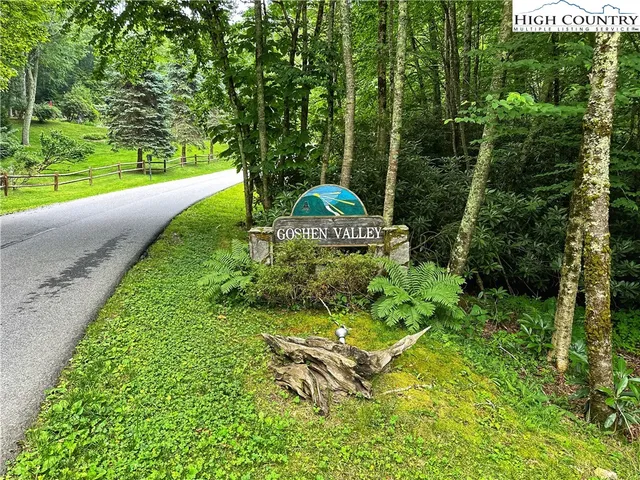 a view of a garden with an outdoor seating