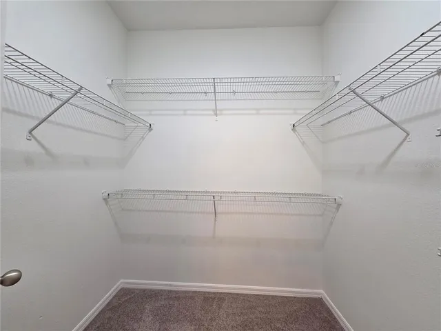 a view of a room with racks on the wall