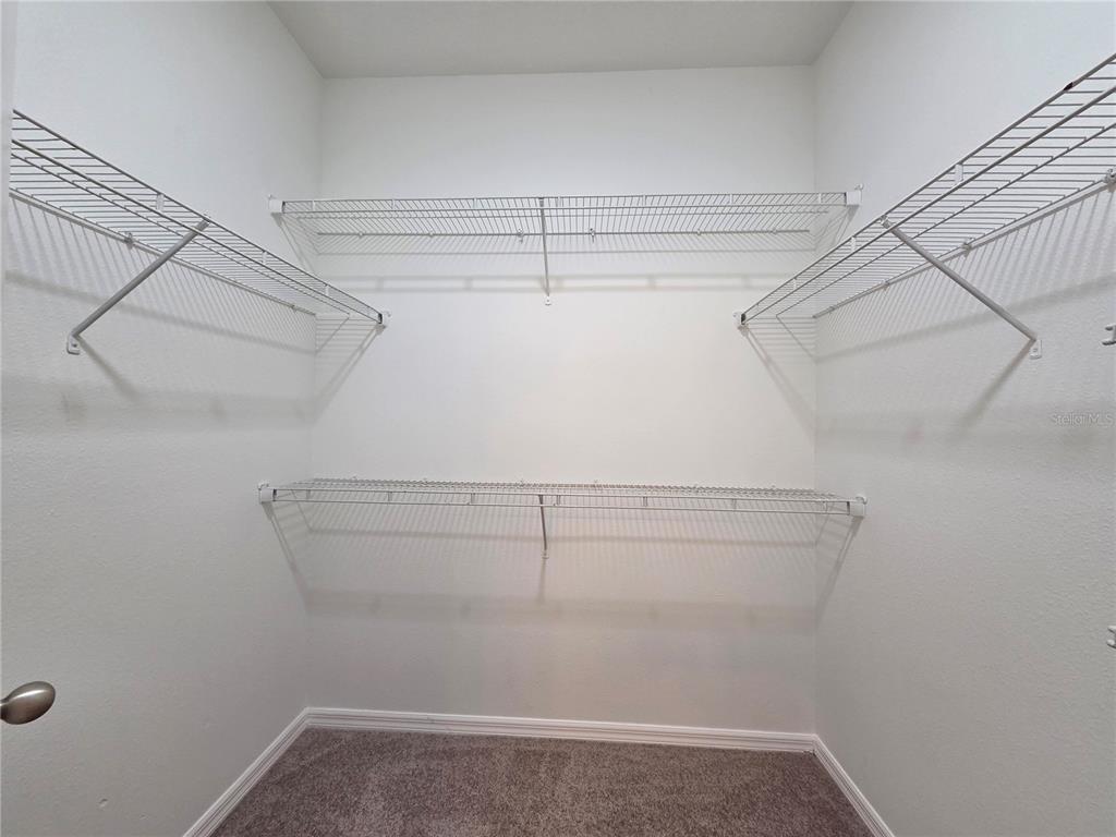 1571 Danisco Place Apopka, FL 32703 - Photo 15 of 26 a view of a room with racks on the wall