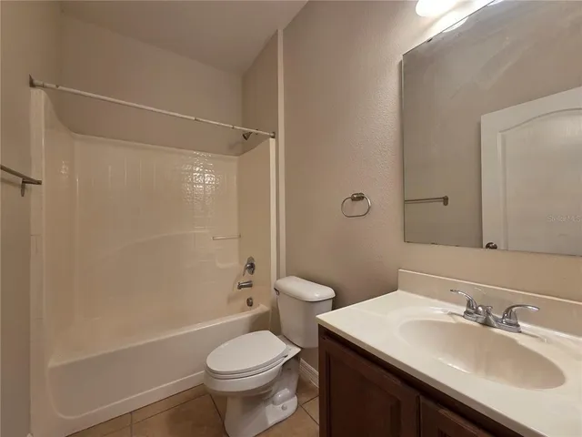 a bathroom with a sink toilet tub and shower