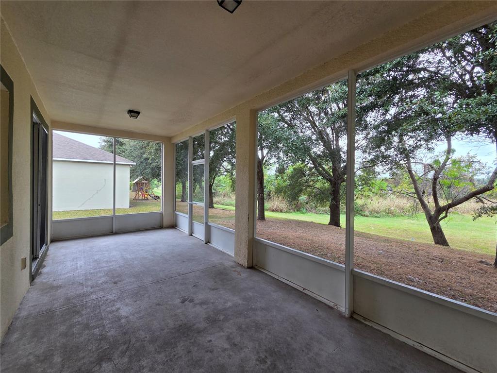 1571 Danisco Place Apopka, FL 32703 - Photo 24 of 26 a view of a room with a large tree and wooden fence