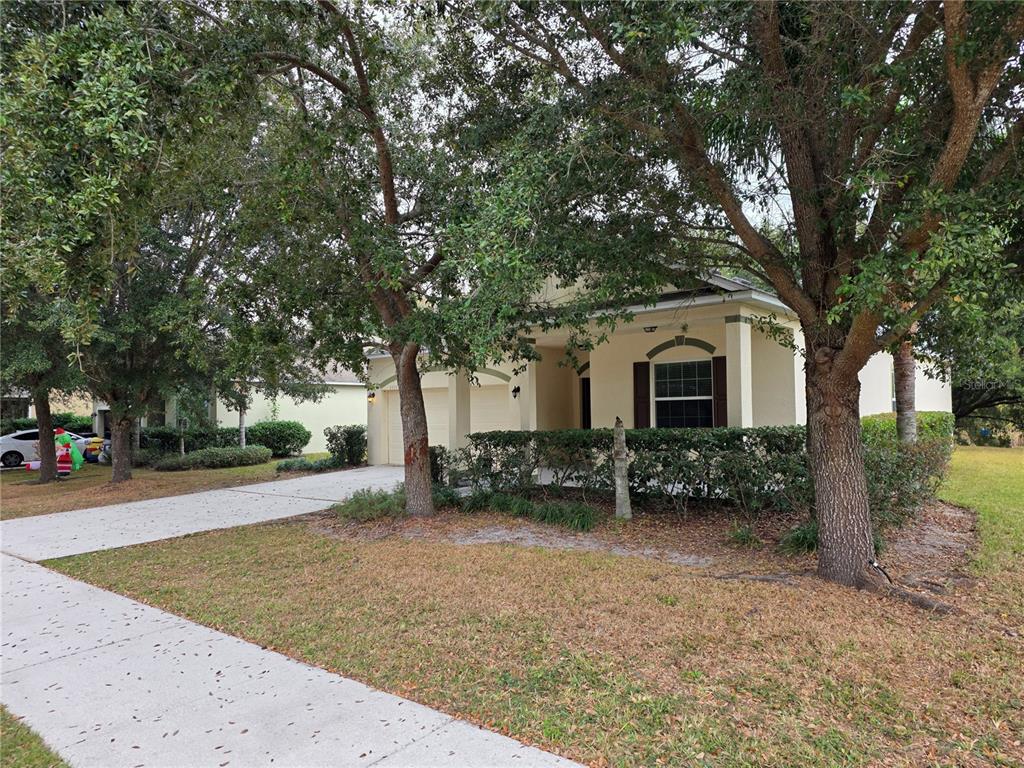 1571 Danisco Place Apopka, FL 32703 - Photo 3 of 26 a view of a house with a yard