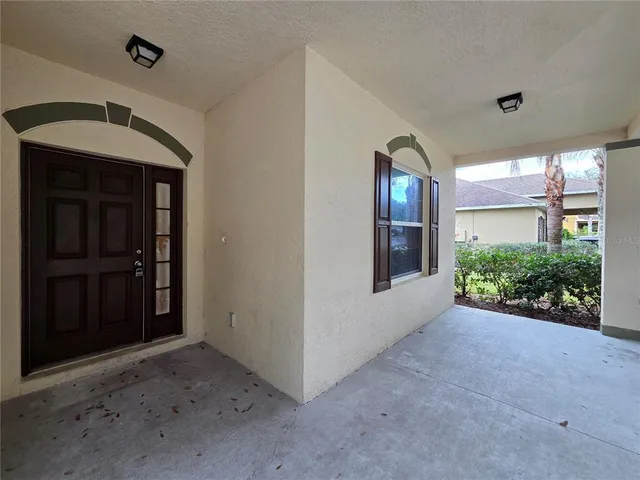 a view of a hallway with wooden shelves