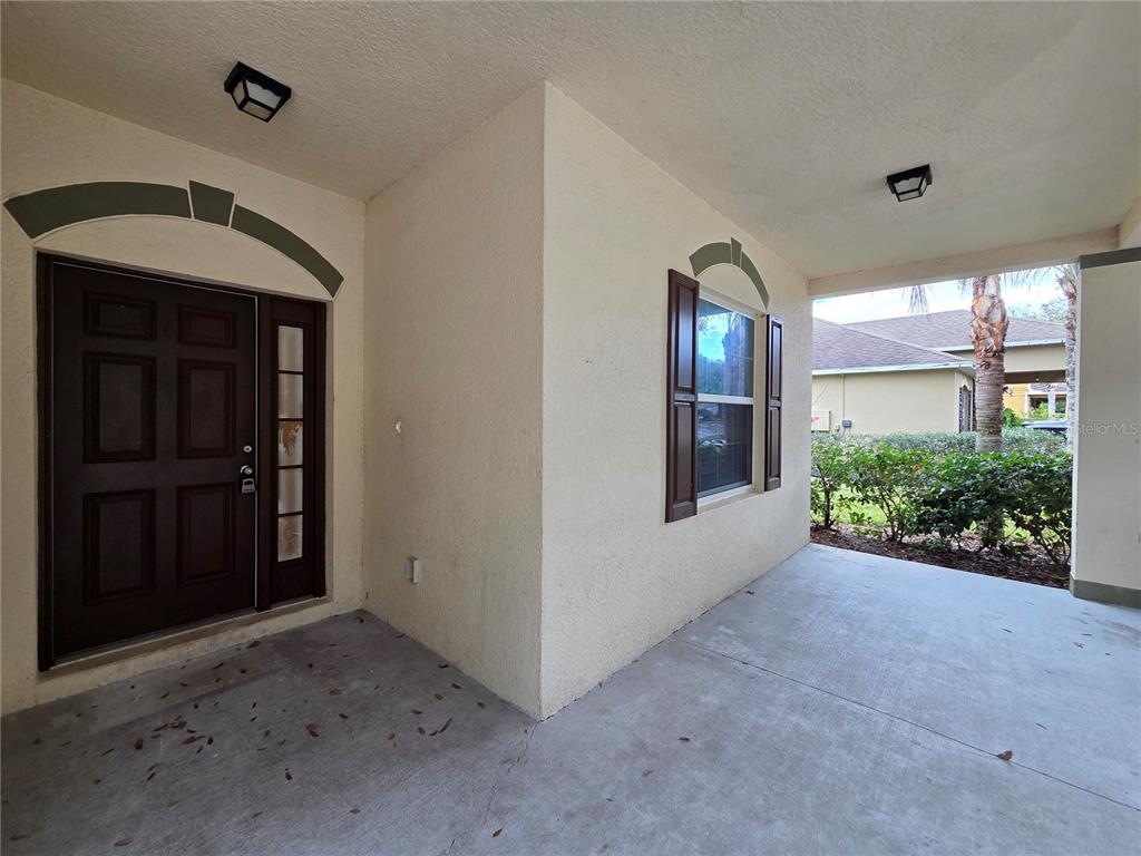 1571 Danisco Place Apopka, FL 32703 - Photo 5 of 26 a view of a hallway with wooden shelves
