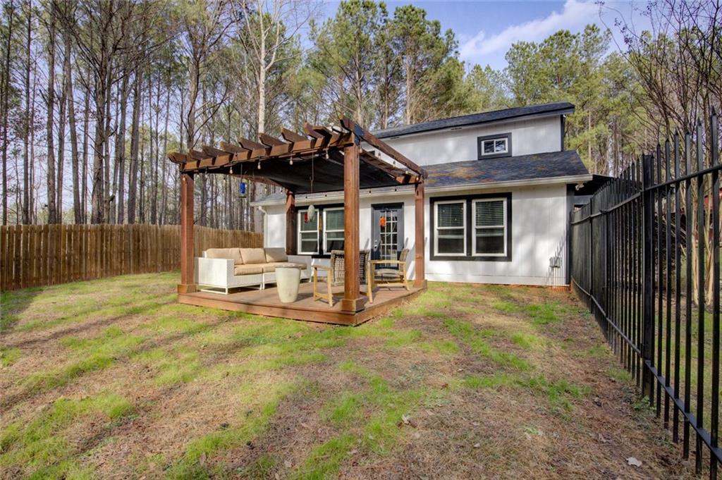 2100 Morgan Lane Covington, GA 30014 - Photo 11 of 47 a view of a house with backyard and sitting area