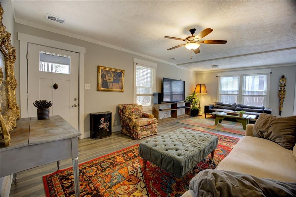 2100 Morgan Lane Covington, GA 30014 - Photo 19 of 47 a living room with furniture ceiling fan and a rug