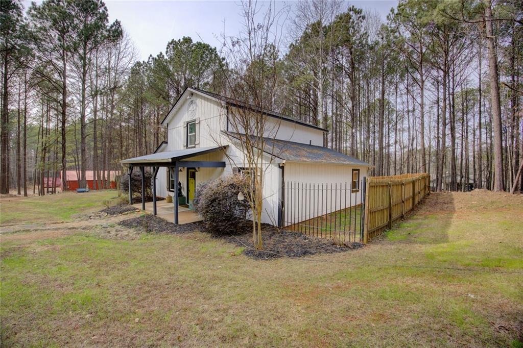 2100 Morgan Lane Covington, GA 30014 - Photo 2 of 47 a view of a house with a yard and tree