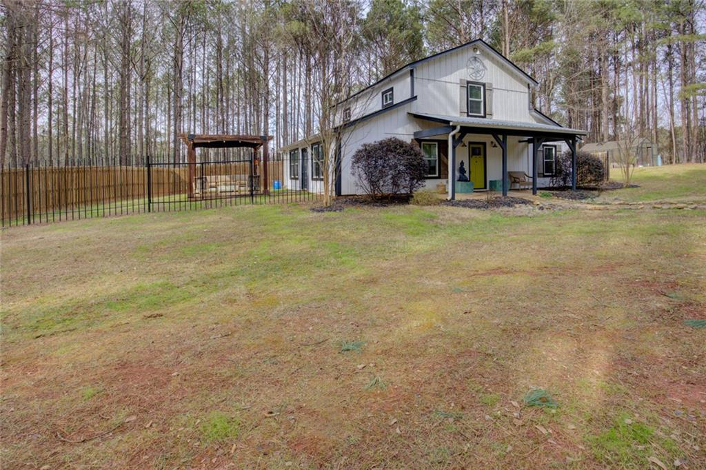 2100 Morgan Lane Covington, GA 30014 - Photo 3 of 47 a front view of a house with garden