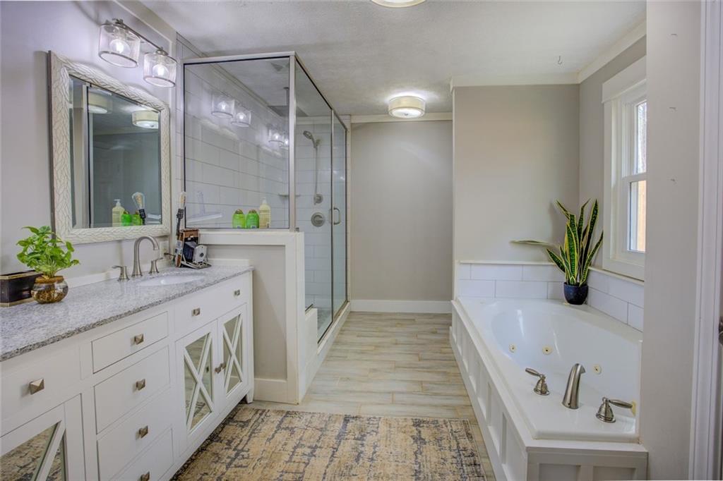 2100 Morgan Lane Covington, GA 30014 - Photo 31 of 47 a spacious bathroom with a double vanity sink and a mirror