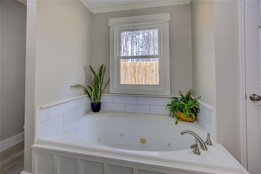 2100 Morgan Lane Covington, GA 30014 - Photo 34 of 47 a white bath tub with a window