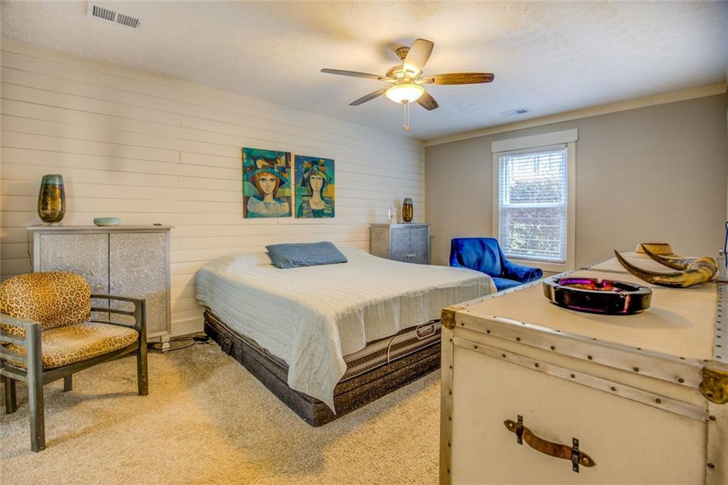 2100 Morgan Lane Covington, GA 30014 - Photo 38 of 47 a bedroom with a bed and a chandelier