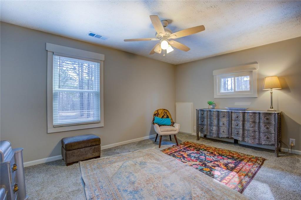 2100 Morgan Lane Covington, GA 30014 - Photo 40 of 47 a bedroom with furniture and a window