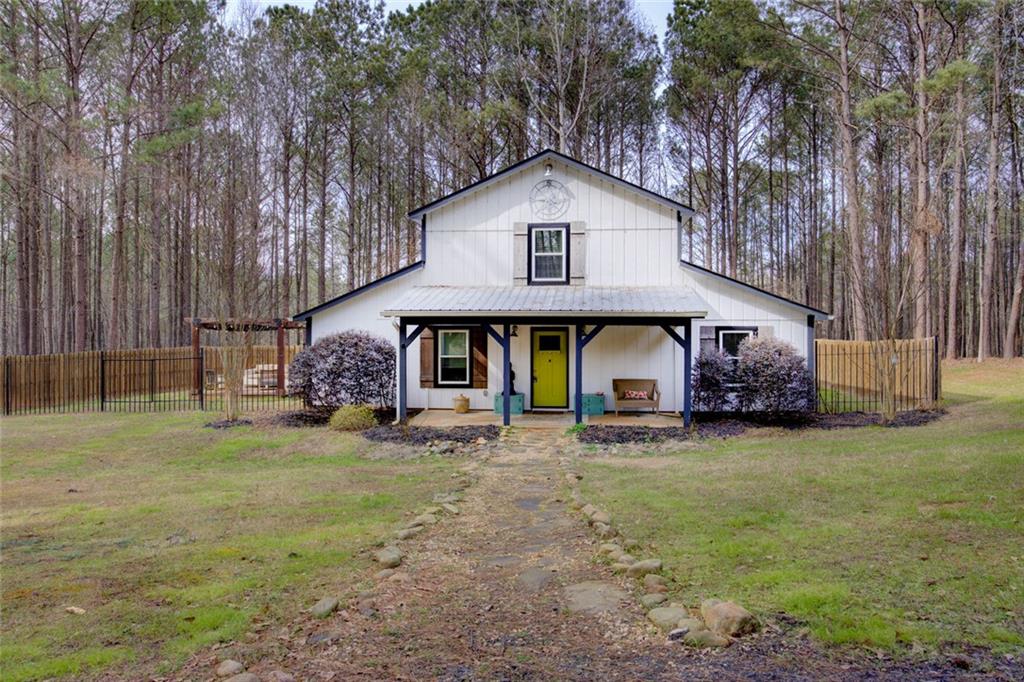 2100 Morgan Lane Covington, GA 30014 - Photo 4 of 47 a view of a house with a yard and garage