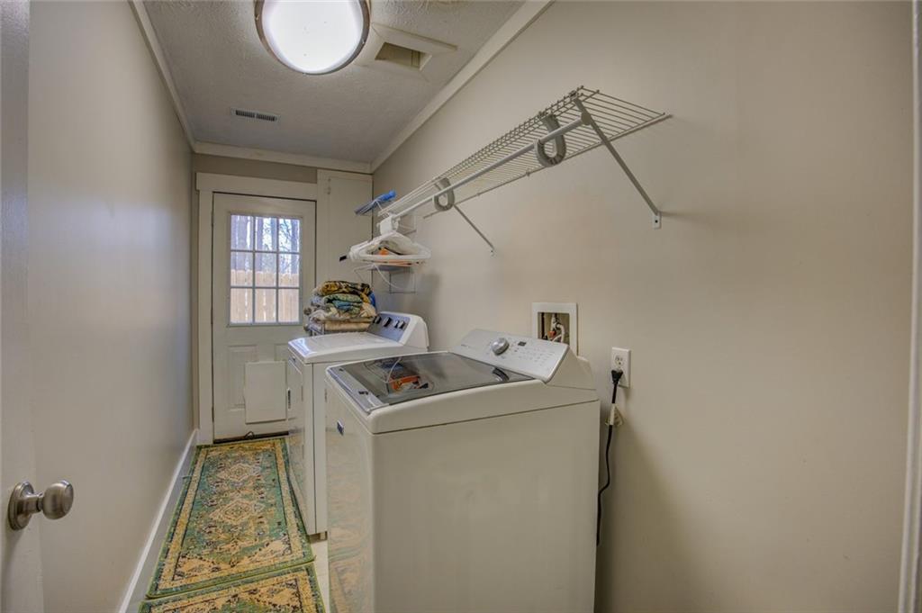 2100 Morgan Lane Covington, GA 30014 - Photo 43 of 47 a utility room with dryer and washer