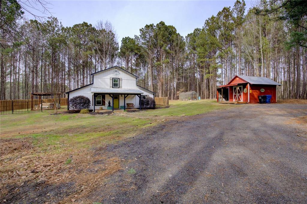 2100 Morgan Lane Covington, GA 30014 - Photo 5 of 47 a front view of a house with a yard and garage