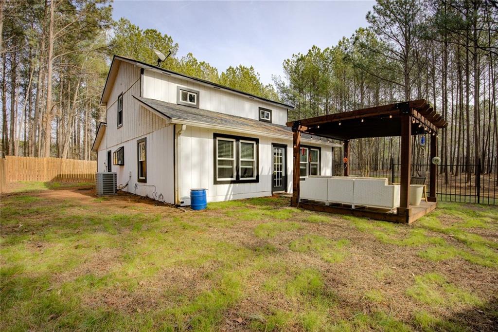 2100 Morgan Lane Covington, GA 30014 - Photo 10 of 47 a view of a house with backyard and a tree
